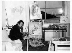 Dalí, painting a picture at his house in Portlligat.