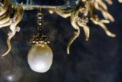 Picture detail of one hanging pearl from Daphne, a jewel designed by Salvador Dali in 1967