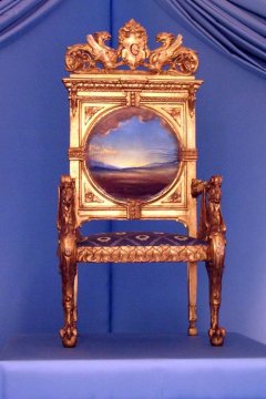 Photography of Dalí's Throne, part of the furniture of Gala and Dalí's Castle in Púbol. It's a chair with a picture on its back.
