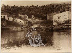 An old photograph of Salvador Dali's House-Museum in Portlligat, where you can see the surroundings of the house and the sea.