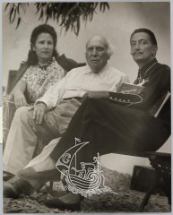 Gala, Salvador Dalí sitting on a bench.