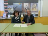 Lluís Peñuelas y Maria Carreras firmando el apadrinamiento