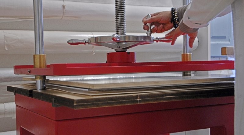 Press used to dry and flatten under weight